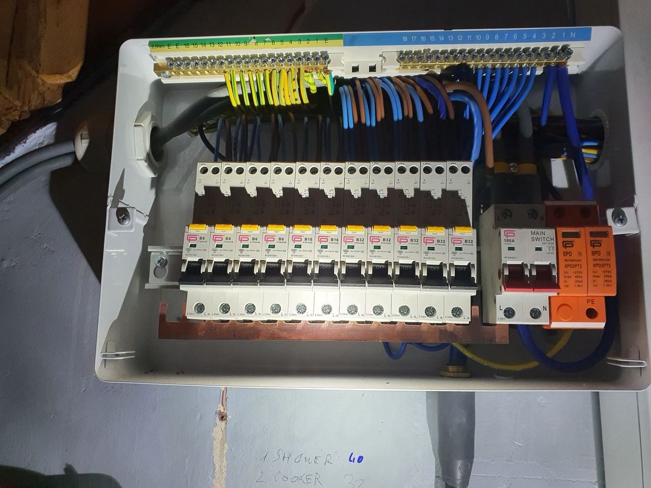 Open consumer unit showing RCBO breakers and tidy circuit wiring