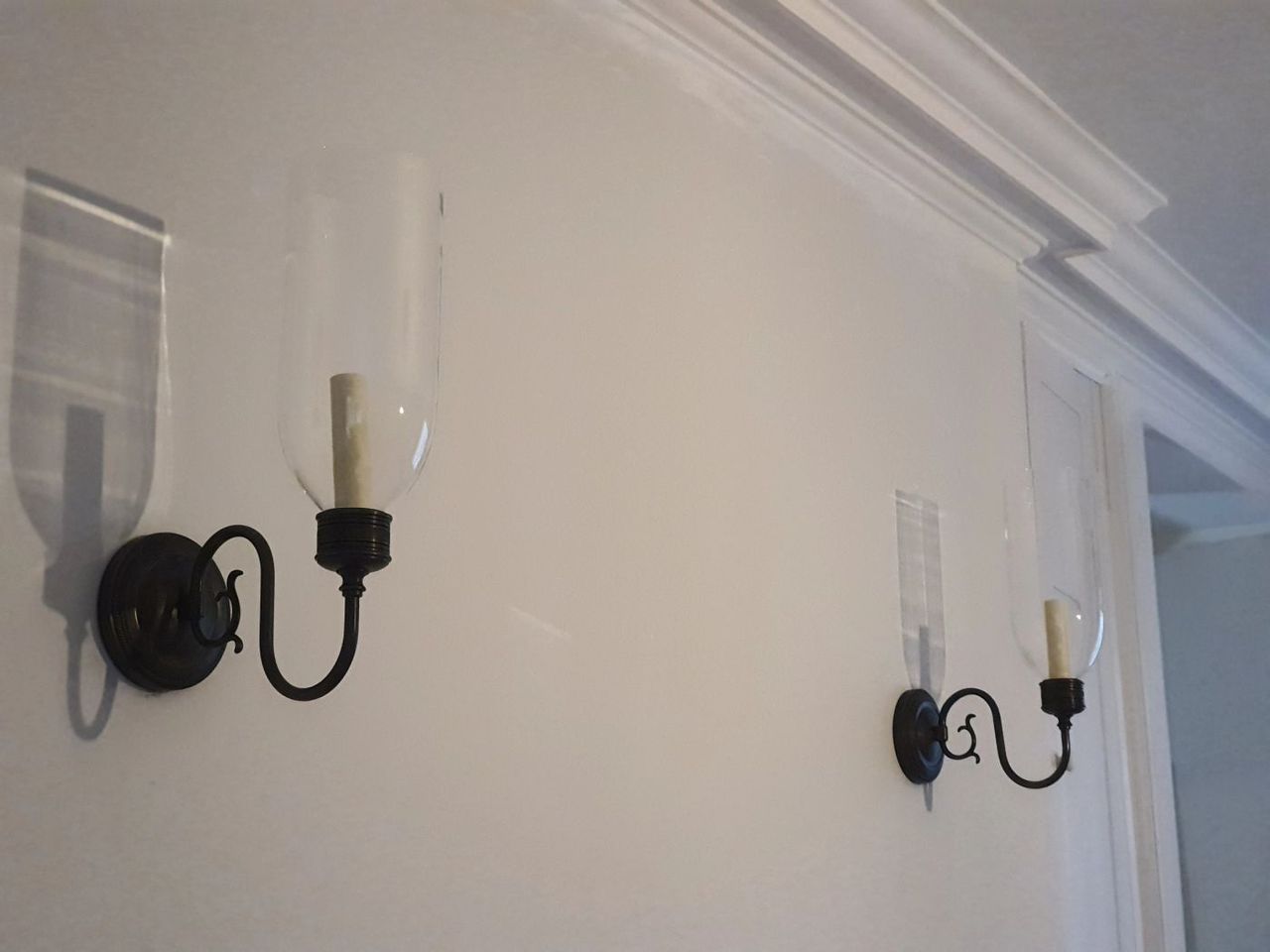 Pair of wall light fittings on a painted wall